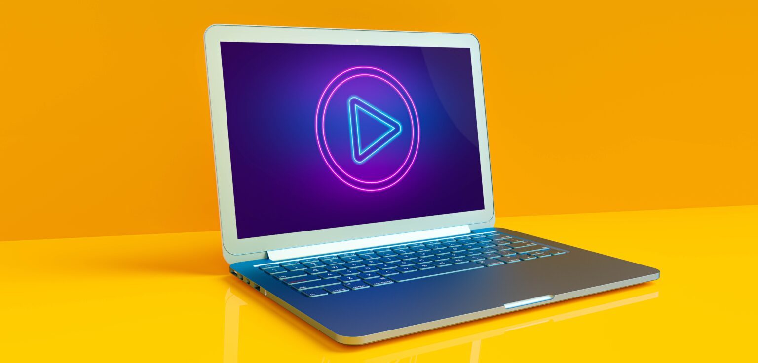 Laptop with play button on the screen