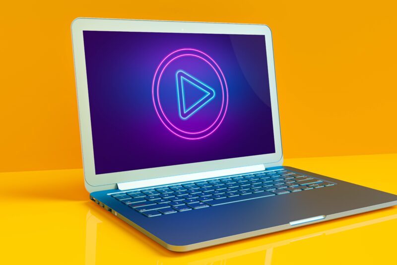 Laptop with play button on the screen